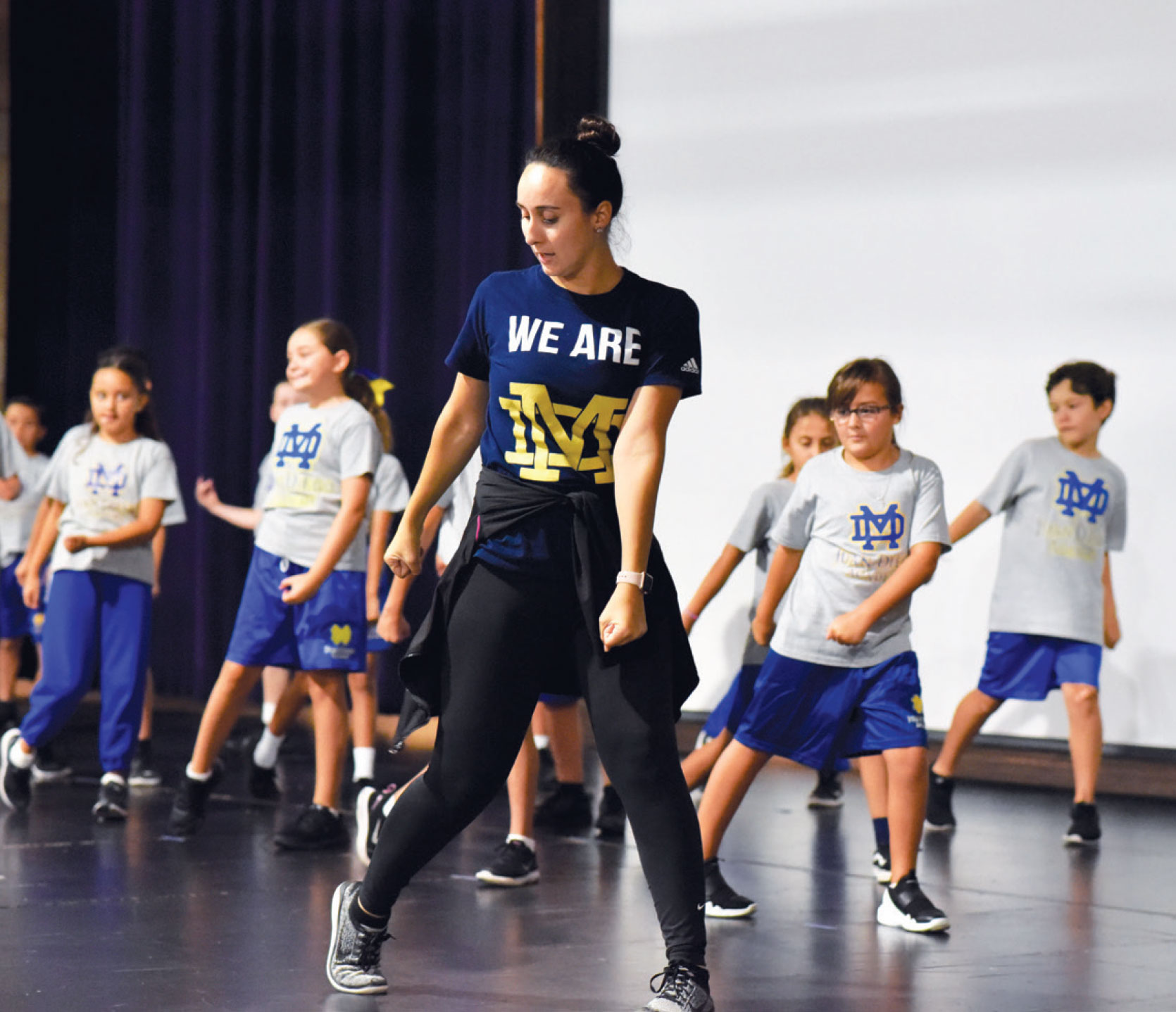 Image of Ms. Brunner leading her dance class of 20 plus students
